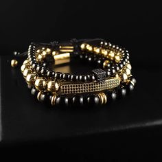 Chase your luck with the Vegas bracelet stack! The Vegas stack features trifecta of beaded beauties - black onyx, golden glitz, and rhodium PVD for a triple threat of style. Plus, a lucky dice and CZ bar for a dash of extra luck. Indulging the adventurous spirit and wandering heart that lives within all of us, our men's bracelet stacks have been crafted to provide a touch of class to your wardrobe throughout the year. Each exquistely curated stack includes a mix of spiritually healing gemstones Timeless Black Stackable Jewelry, Black And Gold Bracelet Stack, Bohemian Black Stackable Jewelry, Black Stackable Bracelet, Black Bohemian Stackable Stretch Bracelet, Triple Threat, Meaningful Jewelry, Gemstone Beaded Bracelets, Premium Gift