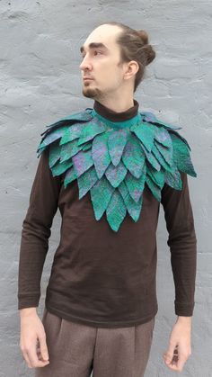 Transform your look with our Leaves Collar Cape  An exquisite accessory designed for fantasy enthusiasts and nature lovers. This elven wardrobe piece, crafted from felted wool and adorned with leaves. The leaf features shades of green and purple, accented with orange veins, creating a magical and mysterious appearance. The lower part is adorned with transitions from green to burgundy and purple, giving the accessory a unique and stylish look, evokes a sense of magic and mystery. Perfect for role Green Fantasy Costume For Costume Party, Green Fantasy Cosplay Costume For Costume Party, Green Fantasy Costume Accessories For Party, Handmade Costume Accessories For Cosplay Events, Handmade Fantasy Costume Accessories For Events, Handmade Fantasy Costume Accessories For Fantasy Events, Green Fantasy Cosplay Costume For Events, Fantasy Costume Accessories For Larp And Cosplay Events, Green Fantasy Cosplay Costume For Fantasy Events