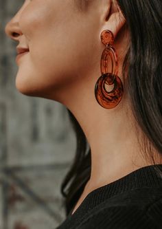 These lightweight Tortoise Shell Acrylic Earrings will compliment many outfits. Acrylic earrings Product is lead and nickel free 2.75" length Jeans And Black Top, Holiday Graphic Tees, Texas Gifts, Sleeveless Skirt, Strung Beads, Christian Tees, Blue Tee, Christmas Gift Jewelry, Acrylic Earrings