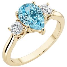 an oval blue topaz ring with three diamonds on the sides, set in yellow gold