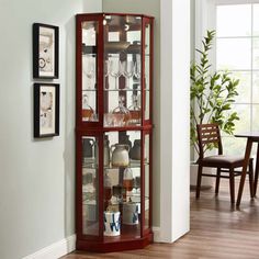 a corner display case with wine glasses on it