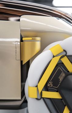 the interior of a car with yellow and white straps on it's seatbelts