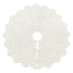 a white doily with an intricate design on the side and a round hole in the middle