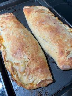 two pieces of bread sitting on top of a pan