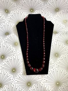 "Length: 28\"  Weight:  43.6 grams 68 Faceted Cherry Beads Screw Clasp Closure" Red Vintage Hand-strung Jewelry, Classic Faceted Beads Necklace For Gift, Vintage Formal Beaded Necklaces With Faceted Beads, Elegant Rondelle Beads For Formal Occasion, Vintage Faceted Round Bead Necklaces, Vintage Faceted Round Bead Necklace, Elegant Formal Hand-strung Beads, Vintage Round Faceted Bead Jewelry, Vintage Jewelry With Polished Oval Beads