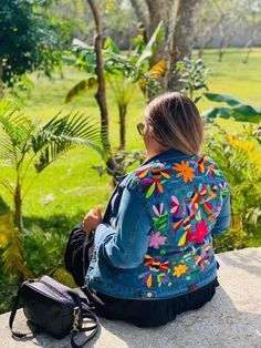 This modern embroidered Otomi Jeans Jacket is made with the most high quality, it is made with a stretchy denim material so it is very comfortable and it will keep you looking stylish all year round. It has pockets and buttons in the front. This Jacket is gorgeous and unique. It is handmade in Mexico with love for you. Casual Floral Embroidery Outerwear For Festivals, Casual Festival Outerwear With Floral Embroidery, Casual Multicolor Embroidered Denim Jacket, Casual Floral Embroidered Outerwear For Festivals, Multicolor Embroidered Long Sleeve Denim Jacket, Embroidered Jean Jacket, Womens Jackets, Most High, Jeans Jacket