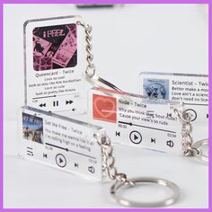 a couple of key chains that are attached to some kind of mp3 player card holder