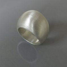 Sterling silver geometric ring, Sculptural ring, Silver statement ring, Chunky silver ring, Bold sil Modern Sterling Silver Dome Ring For Wedding, Minimalist Silver Ring With Concave Shape, Modern Silver Wide Band Wedding Ring, Modern Sterling Silver Dome Promise Ring, Minimalist Silver Wide Band Ring Gift, Minimalist Silver Concave Ring, Silver Minimalist Dome Ring, Handmade Silver Wide Band Ring Minimalist Style, Handmade Silver Minimalist Wide Band Ring