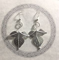 I've fabricated these woodland inspired leaf earrings to be reminiscent of Autumnl, creating two detailed autumn leaves which dangle from ear wire hook style earring components. The leaves are approximately one inch in size and the dangle earrings add another inch for a total length of two inches when worn. I've made these from 22 gauge thick sheet so it's plenty strong and durable with a nice weight when worn, but not too overwhelming to pull or tug the ear lobes. **The last image I've shown th Handmade Leaf-shaped Earrings, Handmade Leaf-shaped Nature-inspired Earrings, Nickel-free Leaf-shaped Nature-inspired Earrings, Woodland Autumn, Woodland Earrings, Leaf Bracelet, Autumn Leaf, Earrings Simple, Simple Earrings