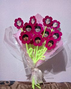 a bunch of flowers with pictures on them