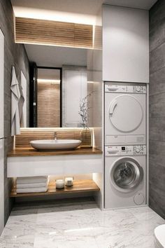 a washer and dryer in a modern bathroom