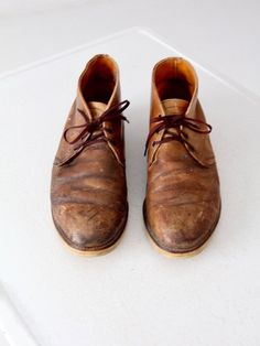 This is a pair of vintage Red Wing leather work boots.  Rich brown leather shapes the boots.  The boots have rubber soles and are marked with the Red Wing tag inside the boot.  A rare size.CONDITIONIn good condition with wear consistent with age and use.MARKED SIZE:  13 DMEASUREMENTSInsole Length: 11.875" ... 30.2 cmWall to Toe Length:  12.875" ... 32.7 cmWidth:  4.5" ... 11.4 cmHeight:  5.5" ... 13.9 cmFor best fit, please compare measurements with a boot of your own.  IC51805 Vintage Lace-up Oiled Leather Boots, Vintage Leather Lace-up Chukka Boots, Vintage Lace-up Boots With Leather Footbed, Vintage Leather Lace-up Work Boots, Vintage Leather Lace-up Desert Boots, Vintage Workwear Boots With Snip Toe, Vintage Workwear Boots With Plain Toe, Vintage Lace-up Chukka Boots With Leather Footbed, Vintage Lace-up Chukka Boots With Rubber Sole