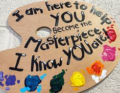 a wooden sign that says i am here to help you become the masterpiece i know you are