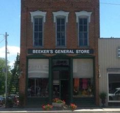 an old brick building with several windows on the front