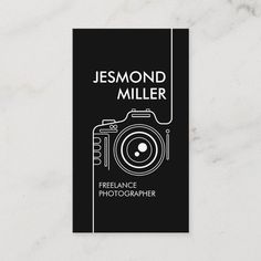 a black and white business card with a camera