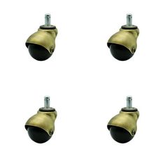 four brass colored casteors with black knobs on each one side and the other end