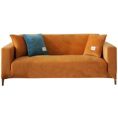 an orange couch with two blue pillows on it's back and a tag in the middle