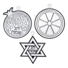 two ornaments with jewish writing on them