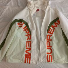 Brand New Supreme Jacket. Rare And High Quality. 100% Authentic With Tags. No Rips Or Stains White Windbreaker With Pockets For Winter, White Windbreaker With Pockets For Fall, White Windbreaker For Winter Streetwear, White Hooded Outerwear With Pockets, White Long Sleeve Windbreaker For Winter, White Track Jacket With Pockets For Fall, White Streetwear Outerwear With Pockets, White Hooded Track Jacket With Pockets, White Hooded Outerwear For Streetwear