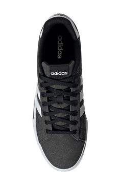 Iconic branding defines a smart sneaker with timeless skate-inspired style. Lace-up style Textile upper and lining/rubber sole Imported Low-top Sneakers With Logo Print For Skateboarding, Sporty Black Skate Shoes With Embossed Logo, Casual Black Skate Shoes With Logo Print, Black Logo Print Skate Shoes For Sports, Black Skate Shoes With Logo Print For Sports, Adidas Textile Sneakers For Streetwear, Black Synthetic Sneakers With Logo, Black Textile Sneakers For Skateboarding, Black Textile Skateboarding Sneakers