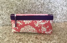 Outstanding pencil pouch. It is perfect for holding writing utensils, and makeup. It is handing for when you are in emergencies, and it is versatile. 100% Cotton Purple Pencil Case With Pen Slots As Gift, Pink Rectangular Pouch With Pen Holders, Rectangular Pink Pouch With Pen Holders, Pink Pencil Case With Zipper Pouch For Organization, Pink Zipper Pouch Pencil Case For Organization, Pink Pencil Case With Zipper For Organization, Purple Pencil Case With Zipper Closure As Gift, Pencil Pouch With Zipper Closure As Gift, Pencil Shaped Pouch With Zipper Closure For Gifts