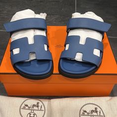 Hermes Womens Chypre Sandals Eu 37 Us 7 Bleu Bleuet Bnib Luxury Blue Sandals For Summer, Luxury Blue Sandals With Removable Insole, Designer Blue Slides For Summer, Designer Blue Slip-on Sandals, Designer Blue Sandals With Round Toe, Modern Blue Slip-on Sandals, Luxury Blue Slides For Summer, Designer Blue Slides With Branded Insole, Blue Slip-on Modern Sandals