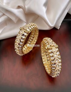 Bridal jewelry is never complete without the bridal bangles adorning the hands and arms full of henna! Classic and elegant set of bangles showcasing fine foil Polki Kundan stones with Pearl Piroyi. Available in 2 sizes. Openable Bangles. 👉🏻Available in different sizes: 2.4 / 2.6 adjustable, openable. ✅ WHAT GOES IN 👉🏻Premium Quality raw materials, high class finishing. ✅ SOURCING & PACKAGING 👉🏻Ethically Sourced, Indian high quality raw materials used. 👉🏻All items arrive in meticulously p Kundan Bridal Bangle Sets For Wedding, Bollywood Style Bangle For Reception, Bollywood Style Intricate Bracelets For Reception, Wedding Kundan Bracelets With Tilla, Wedding Kundan Bracelets With Tilla Detail, Kundan Bracelets With Tilla For Wedding, Bollywood Style Bracelets For Reception With Intricate Design, Bollywood Style Bracelets With Intricate Design For Receptions, Bollywood Kundan Wedding Bracelets