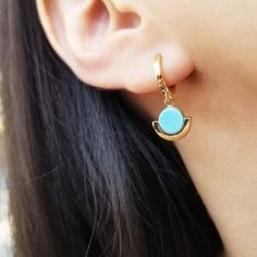 "Geometry gets sophisticated in these huggie hoops with round turquoise-colored pendants plated in 14-karat gold dangling freely. ♥ Available in Gold and Silver ♥ 18K Gold Plated / Rhodium on The Top of 925 Sterling Silver ♥ Available in 6 mm, 8 mm, 10 mm Inner Hoop Diameter ♥ Measurement of Turquoise Pendant: 12 mm Tall and 11 mm Width ♥ Nickel Free ♥ Sold as Single (ONE earring) or A Pair ♥ All items are packed inside an elegant Gold Spoon jewelry box. If you are purchasing a product to send a Trendy Turquoise Hoop Earrings As Gift, Modern Turquoise Dangle Jewelry, Trendy Turquoise Drop Earrings, Modern Turquoise Dangle Earrings, Everyday Turquoise Pierced Earrings, Everyday Turquoise Earrings For Pierced Ears, Modern Hypoallergenic Turquoise Earrings, Modern Turquoise Hypoallergenic Earrings, Turquoise Dangle Hoop Earrings