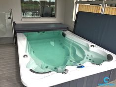 an indoor hot tub in the middle of a room