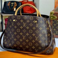 Louis Vuitton Montaigne Mm Monogram Lifetime Money Back Authenticity Guaranteed Made In France Date Code Tr1174 100% Guaranteed Authentic Measurements: 13" L X 9" W X 5" H Great Preowned Condition (8.5/10) Handles Do Have Some Marks As Shown Clean Interior Comes With The Original Shoulder Strap Dust Bag Is Included, No Box (*Cotton Dust Storage Bag May Have Marks Or Stains) 100% Lifetime Guarantee On Authenticity Overall Great Condition. Slightly Darkened And Signs Of Usage On Handles. Marks On The Base Of One Of The Handle. Clean Interior. We Rate It 8.5/10. Canvas, Strap And Interior Is In Great Condition. Louis Vuitton Montaigne Mm, Louis Vuitton Montaigne, Mm Monogram, Storage Bag, Made In France, Louis Vuitton Bag, Bag Storage, Satchel, Dust Bag