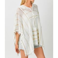 Details & Care - Ivory color - Beige stripes design - V-neckline - Front lace up detail - Large front pocket - Fringe bottom detail - Poncho hoodie - Available in sizes S/M, M/L - Fabric: 60% cotton, 40% acrylic - Hand wash in cold water. Hang to dry. Size Info Small/Medium (S/M): 2 - 8 Medium/Large (M/L): 8 - 12 Need help knowing your size? Use our size guide. Model Measurements Model is 5'9" and wearing a size S/M. White Drawstring Top For Vacation, White Summer Top With Drawstring Hood, White Drawstring Hooded Top For Summer, White Drawstring Hood Top For Summer, Casual Hooded Poncho For Spring, Casual Hooded Spring Poncho, White Drawstring Top For Beach, White Drawstring Beach Top, Casual White Poncho For Fall