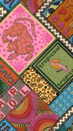 a colorful patchwork design with animals and letters on it's sides, in different colors