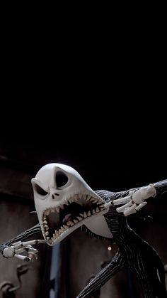 a skeleton with an open mouth and large teeth