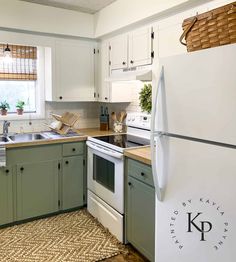 a white refrigerator freezer sitting inside of a kitchen next to a stove top oven