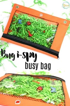 two orange bags filled with green grass on top of a white table covered in butterflies