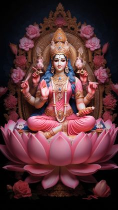 a statue of the hindu god sitting on top of a pink flowered lotus in front of a black background