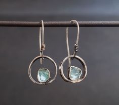 "Silver dangle earrings Blue stone earrings Silver earrings for women Circle dangle drop Sterling jewelry Rustic silver Raw stone apatite ATTENTION: Each stone is identical and different in shape. That's why every pair of earrings will be unique and still beautiful. Sizes are about 3/4 \"But trust me the earrings will still be lovely. Thanks Blue Apatite is a motivational stone, promoting independence and ambitiousness. A stone of the Throat Chakra, Blue Apatite helps with public speaking and en Silver And Stone Jewelry, Silver Earrings With Stones, Sterling Silver Wire Wrapped Crystal Earrings, Adjustable Silver Crystal Gemstone Earrings, Silver Apatite Dangle Earrings, Turquoise Dangle Jewelry Birthstone, Turquoise Dangle Birthstone Jewelry, Adjustable Silver Birthstone Earrings, Handmade Apatite Dangle Jewelry