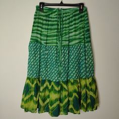 Elevate Your Wardrobe With This Vibrant And Stylish Chaudry Skirt, Brand New With Tags! This Stunning Piece Features A Unique Blend Of Abstract Patterns All In A Rich Green Hue That’s Perfect For Any Season. Whether You’re Dressing Up For A Special Occasion Or Adding A Pop Of Color To Your Everyday Look, This Skirt Is A Must-Have. Pair It With Your Favorite Top And Accessories To Create A Chic And Fashionable Ensemble. Don’t Miss Out On This Eye-Catching Piece! *Sample Piece* Green Flowy Cotton Skirt, Green Casual Flowy Skirt, Green Bohemian Midi Skirt, Casual Green Flowy Skirt, Green Skirt Bottoms For Beach, Green Cotton Maxi Skirt For Vacation, Green Midi Skirt With Elastic Waistband, Flowy Green Cotton Skirt, Green Flowy Skirt For Beach