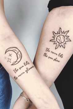 two people with tattoos on their arms holding each other's hands and one has the sun and moon