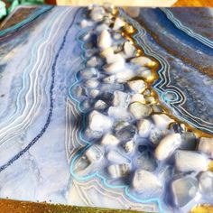 "Geode Mini Art inspired by one of the most serene stones in my collection. I have loved blue lace agate for all its delicate lines and soft beautiful color. This mini Geode painting is a calm shade of blue and has lots of details and textures. A Small Luxury with lots of Sparkle for your space. This painting Is done on a cradled birch board, 6\"x6\" inch with a height of 1.5\" I hope you like it xx lol" Blue Agate Geodes With Natural Stones, Blue Agate Geodes, Handmade Blue Geodes As A Gift, Handmade Blue Geodes As Gifts, Handmade Blue Geodes For Gifts, Handmade Blue Geodes For Gift, Bohemian Agate Geodes As A Gift, Geode Painting, Blue Geode