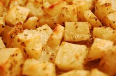 closeup of cooked potatoes with seasoning sprinkled on the top and bottom