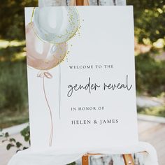 a welcome sign with balloons on it for someone to have their photo taken at the ceremony