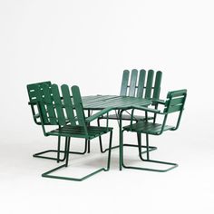 a group of green chairs and table against a white background with no one in it