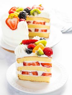 two slices of cake with fruit on top and one slice cut from the rest of the cake