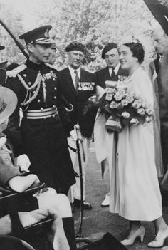 an old black and white photo of a couple getting married