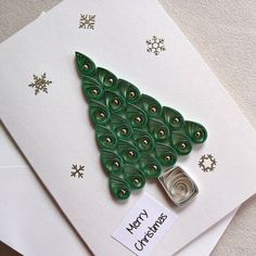 two christmas cards, one with a green tree on it and the other decorated with buttons