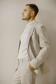 "Our men's simple wedding suit (set of 3) is handcrafted to fit your individual body measurements. We take pride in the fact that there are no factory processes involved in making our linen clothes for men. Each linen suit ensemble is made with care and attention to detail. SIZING To ensure the perfect fit of this men's linen suit, I will email you after you place your order, kindly requesting the measurements. This way, the cut will be tailored precisely to unique body shape. THE PROCESS WILL BE VERY SIMPLE AND EASY! I am here to assist you throughout the entire process, addressing any questions or concerns you may have. Color in the picture: natural linen and snow white. Other colors are available. The model in the picture is 186 cm (6'1\") tall and is wearing size L. DESCRIPTION: Our si Beige Linen Suit For Wedding, Linen Wedding Suit With Suit Collar, Beige Linen Wedding Suit, Wedding Linen Set With Notch Lapel, Wedding Linen Sets With Notch Lapel, Tailored Linen Suit For Wedding, Single-breasted Linen Wedding Suits, White Linen Wedding Blazer, Simple Wedding Suit