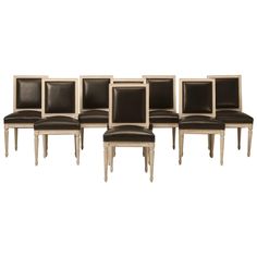 six chairs with black leather upholstered backrests