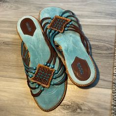 Size 10m Turquoise, Brown, Tan. Turquoise Round Toe Sandals For The Beach, Casual Turquoise Synthetic Sandals, Turquoise Round Toe Synthetic Sandals, Turquoise Synthetic Sandals With Round Toe, Casual Flat Turquoise Sandals, Casual Turquoise Flat Sandals, Casual Turquoise Open Toe Sandals, Turquoise Leather Sandals For Beach, Casual Turquoise Slip-on Sandals