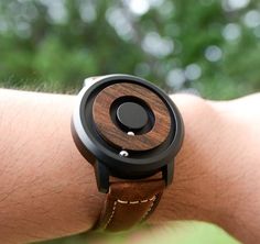 A MINIMALIST WATCH THAT LOOKS AND WORKS UNLIKE ANY OTHER. SEE AND FEEL TIME MOVE LIKE NEVER BEFORE THANKS TO OUR REVOLUTIONARY MAGNETIC TECHNOLOGY. UNIQUE, STYLISH AND LUXURIOUS. ALL IN ONE!100% Real Natural Dark (RECLAIMED) WOOD Wrist Watch. Each Unique Watch is Handcrafted by a Professional Watchmaker. You'll be amazed when you hold a wood watch in your hand or wear it on your wrist since it is really comfortable. High Quality, Luxury Fashion and Stylish with Japanese Movement. It comes with N Minimalist Brown Watch As A Gift, Minimalist Brown Watch As Gift, Rose Gold Tungsten, Personalized Watches, Great Anniversary Gifts, Wood Wedding Band, Minimalist Watch, Wooden Watch, Watches Unique